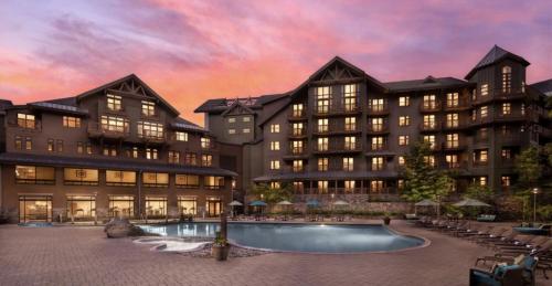 a rendering of a large building with a swimming pool at 337 - Studio- Lodge At Spruce Peak -Stowe Mt Resort- Ski in Ski out - Sleeps 4 in Stowe