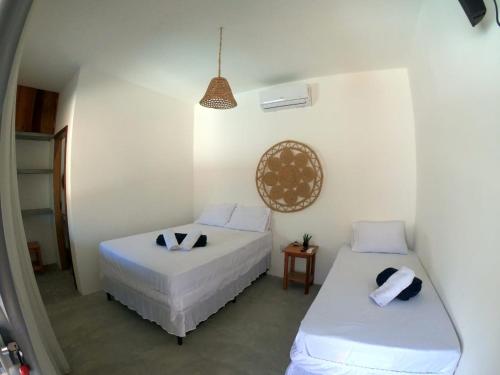 Postel nebo postele na pokoji v ubytování Chalé Begê