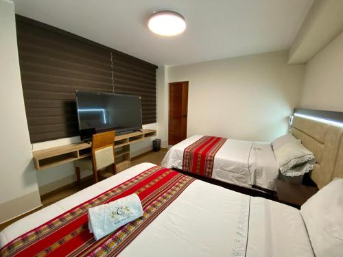 Postel nebo postele na pokoji v ubytování Hotel Sonccollay