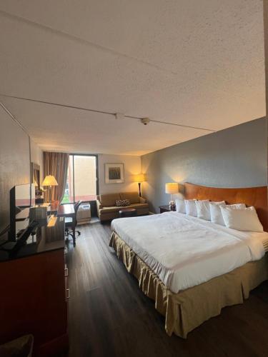 Ένα ή περισσότερα κρεβάτια σε δωμάτιο στο The Grand Hotel Spindletop