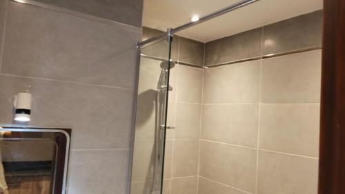 a shower with a glass door in a bathroom at Avenue Alhambra princess resort in Hurghada