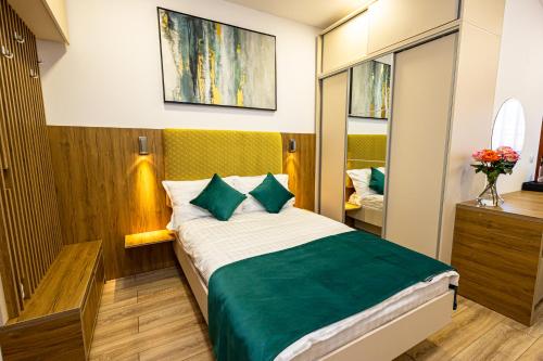 Postel nebo postele na pokoji v ubytování Pensiunea Ținutul Mărului