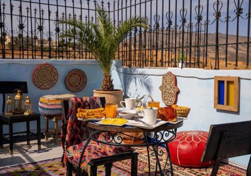 a table with a tray of food on a patio at Riad misk lile fez in Fès