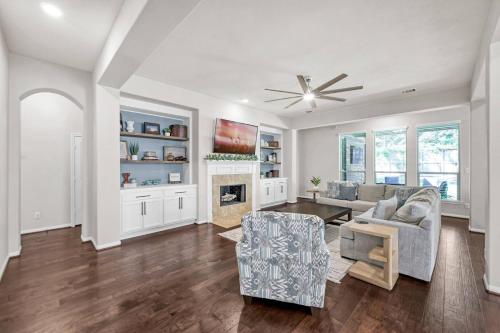 a living room with a couch and a fireplace at Aspen Drive in Montgomery
