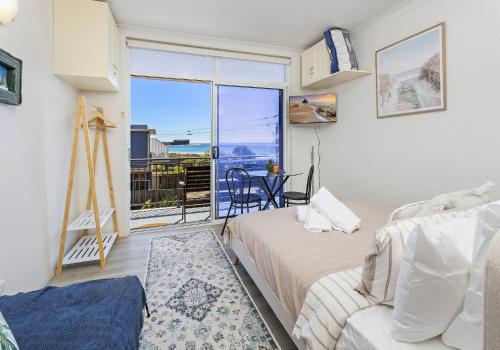 Ένα ή περισσότερα κρεβάτια σε δωμάτιο στο Kiama Dreams