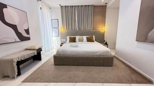 a bedroom with a large bed and a large window at Rorex cozy cityview 1 bedroom apartment in Lekki