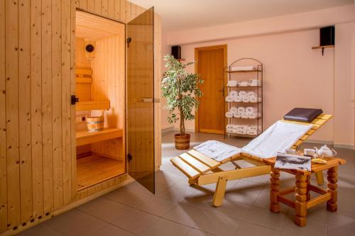 a room with a chair and a table at Valle Del Buttero in Capalbio