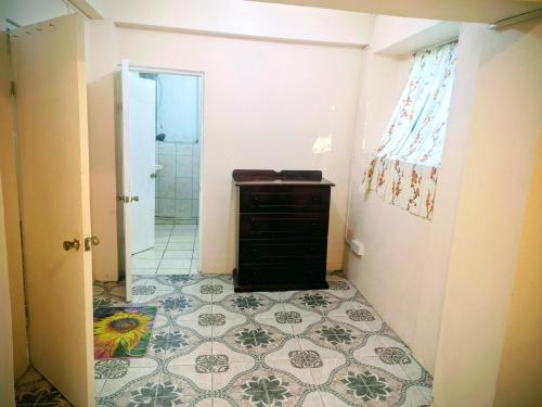 a bathroom with a sink and a tile floor at BtC Apartments St Paul's in Saint Paulʼs