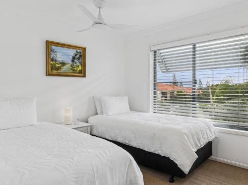 Ένα ή περισσότερα κρεβάτια σε δωμάτιο στο Villa 3 - The Breakers Resort