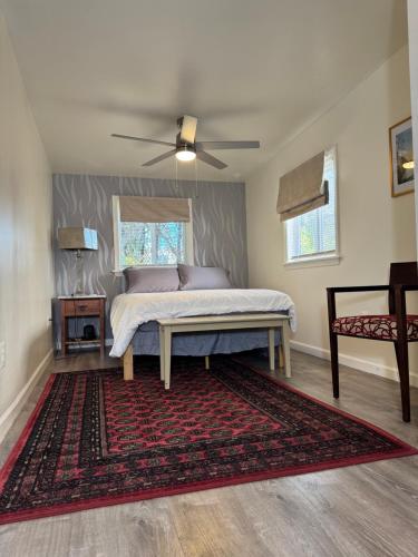 a bedroom with a bed with a ceiling fan at Providence & 18th in Chester