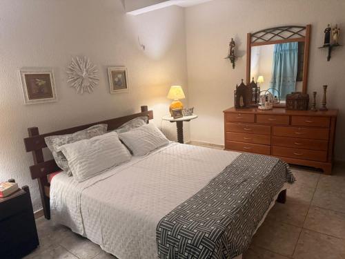 Giường trong phòng chung tại Sítio São Gerardo - Aconchegante casa no campo.