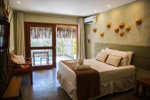 Postel nebo postele na pokoji v ubytování Kaçuá Milagres