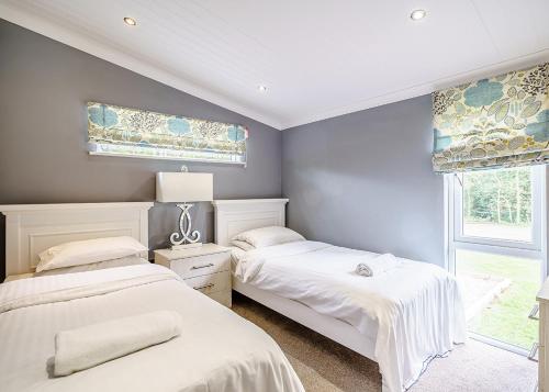 Ένα ή περισσότερα κρεβάτια σε δωμάτιο στο Ladera Retreat Lodges