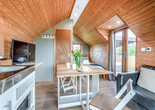 a kitchen and living room with a wooden ceiling at South View Retreat in Carlton