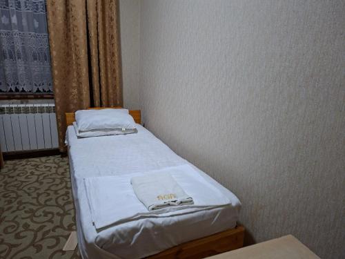 Voodi või voodid majutusasutuse Royal garden toas