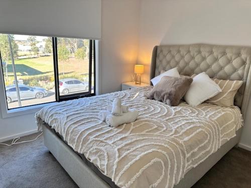 Postel nebo postele na pokoji v ubytování Family Time by the park