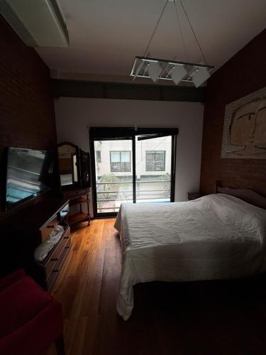 Ένα ή περισσότερα κρεβάτια σε δωμάτιο στο Departamento