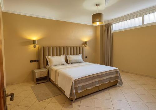 Ένα ή περισσότερα κρεβάτια σε δωμάτιο στο Luxury apartment with garden view