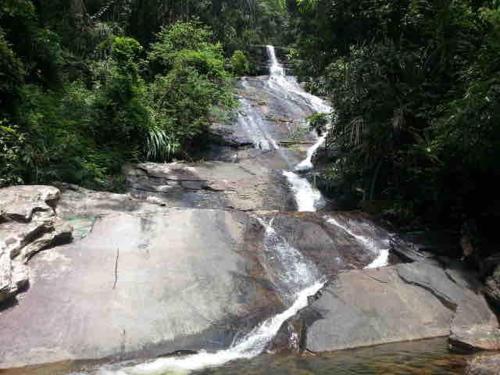 a waterfall in the middle of a river at Habibie Homestay-Gunung Jerai in Guar Chempedak