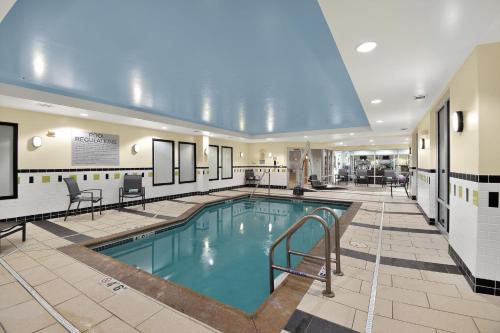a large swimming pool in a hotel lobby at Fairfield Inn & Suites by Marriott Omaha Downtown in Omaha