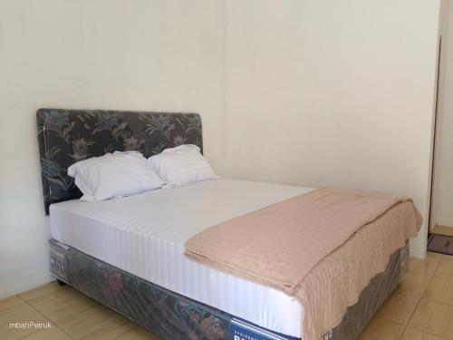 Postel nebo postele na pokoji v ubytování Omahe Petruk