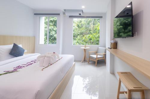 Ένα ή περισσότερα κρεβάτια σε δωμάτιο στο Ao Nang CheapPer Hotel