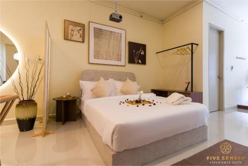 a bedroom with a large white bed in a room at KIP Core Soho Suite by Five Senses in Sepang