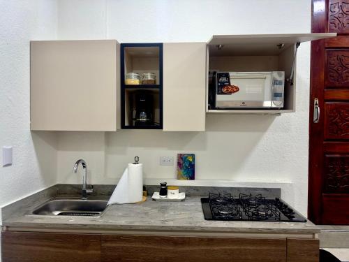 Η κουζίνα ή μικρή κουζίνα στο Atractivo apartamento