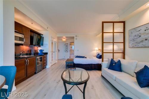 a living room with a couch and a table in a room at The Condos at MGM Signature Hotel in Las Vegas