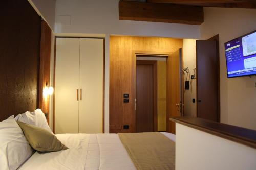 Ein Bett oder Betten in einem Zimmer der Unterkunft Sole della Franciacorta - Hotel & Restaurant