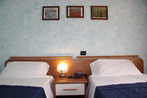 Ein Bett oder Betten in einem Zimmer der Unterkunft Sole della Franciacorta - Hotel & Restaurant