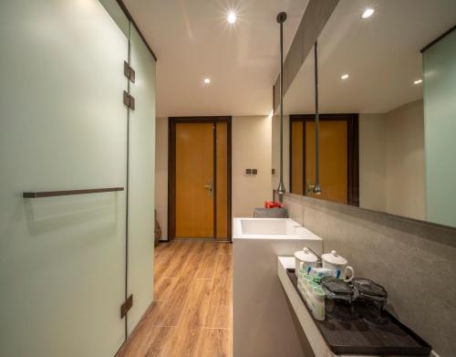 a bathroom with a sink and a mirror at Nan she in Datong
