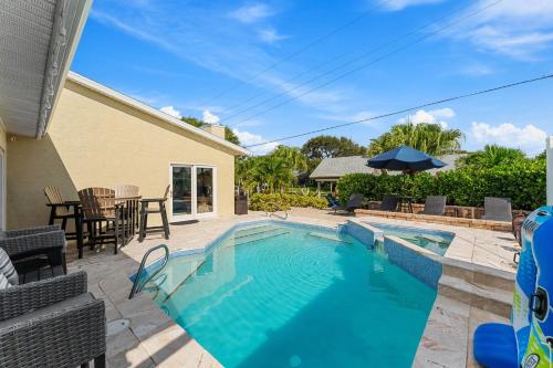 a swimming pool in the backyard of a house at 445 Watts Way in Cocoa Beach