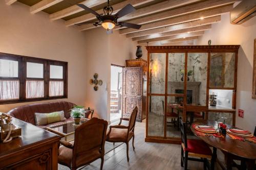 a living room with a couch and a table at Casa Sollano 34 in San Miguel de Allende