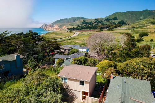 an aerial view of a small town next to the ocean at Stunning Oceanview Coastal Home Beach Trails Family Activities in Montara