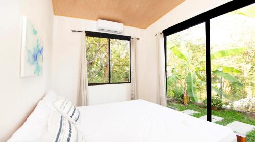 Ένα ή περισσότερα κρεβάτια σε δωμάτιο στο Villa Palmarcito