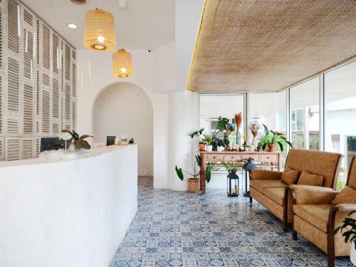 a living room with a couch and a table at Royal Beach View in Pattaya South