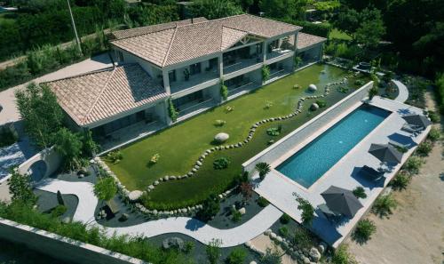 an aerial view of a house with a swimming pool at Maison du Lac in Les Angles Gard