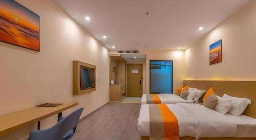 Postel nebo postele na pokoji v ubytování Shell Hotel Wuxi Gonghu Avenue Vientiane City