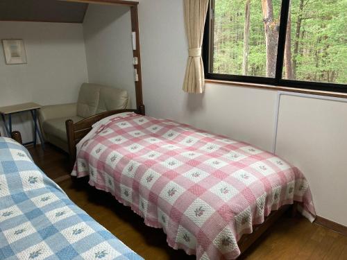 Ένα ή περισσότερα κρεβάτια σε δωμάτιο στο Lodge Jotenki