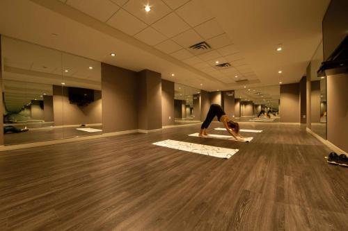 a person doing a yoga pose on the floor of a building at The Idea in Toronto