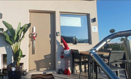 a santa hat sitting on the back of a house at ''Aetheria'' Rooftop Resort with sea view in Kremasti