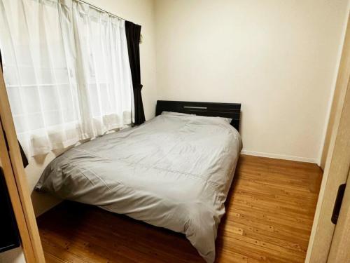 Postel nebo postele na pokoji v ubytování 302便利な立地札幌駅が徒歩7分の超人気で美室女性に人気