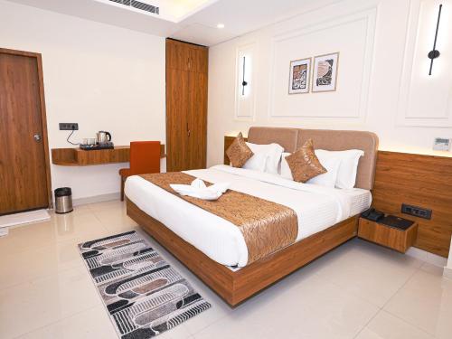 Voodi või voodid majutusasutuse Saswata Hotels By Kamay Group toas