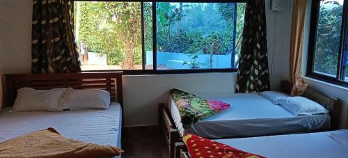 Voodi või voodid majutusasutuse HIDEEN VALLERY RIVERSIDE HOMESTAY A Unit Of EPIC Holidays toas