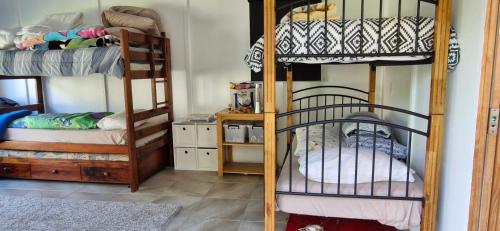 Postel nebo postele na pokoji v ubytování Blue Horizon Hideaway