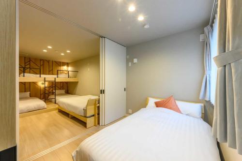 Ένα ή περισσότερα κρεβάτια σε δωμάτιο στο Darin大濠公園北