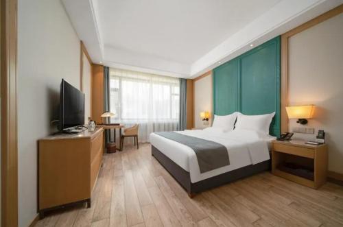 Μια τηλεόραση ή/και κέντρο ψυχαγωγίας στο World Hotel Jinan Harmony Plaza Qilu Children's Hospital Branch