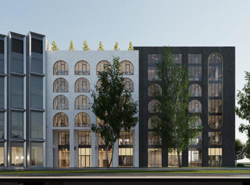 um prédio com uma árvore na frente em Hyatt Place Tallinn em Taline