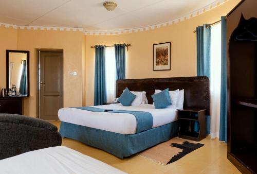 Ένα ή περισσότερα κρεβάτια σε δωμάτιο στο Tafaria Castle & Center For The Arts